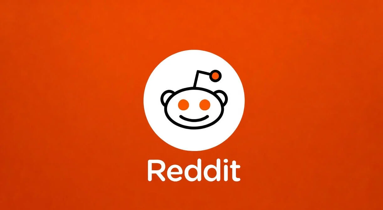 Logo de Reddit sobre un fondo naranja sólido